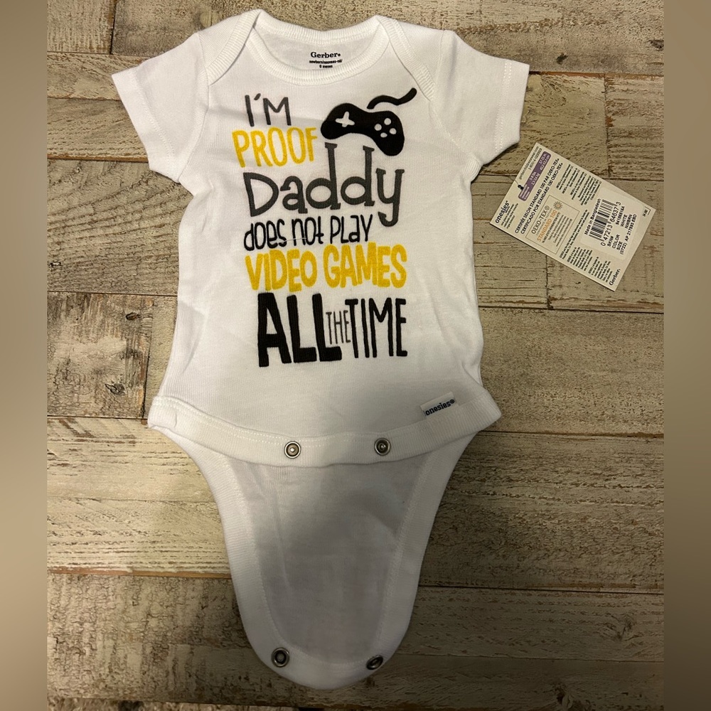 NWT Gerber Onesie 0M “I’m proof daddy does not play video games all the time”